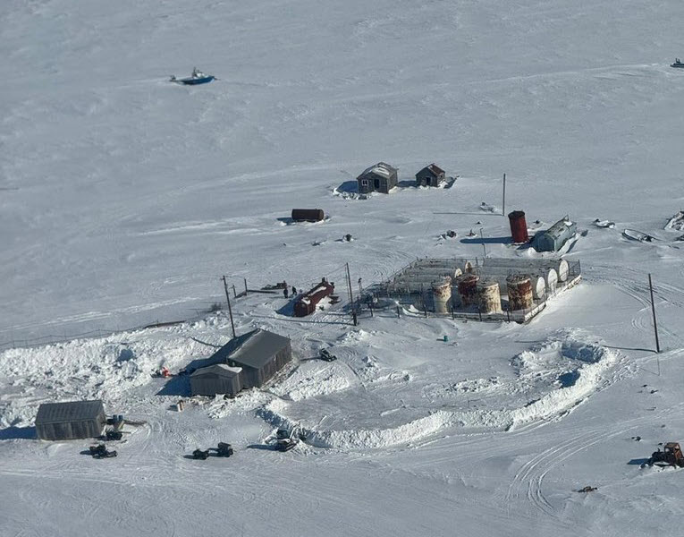 Aerial view of the spill site at Kwigillingok, Alaska. The snow berms constructed to contain the diesel are visible.