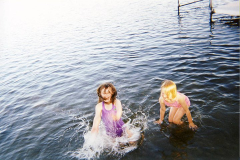 Two children in a body of water.