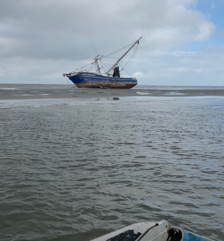 A vessel grounded on a sand bar. 