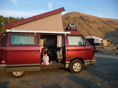 A child in a camper van. 