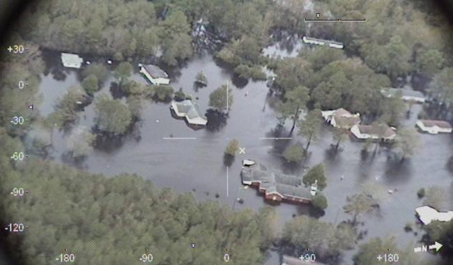 An aerial view of a flooded residential area.