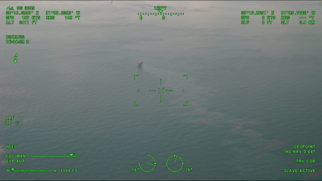 An aerial image of oil coming from a platform.