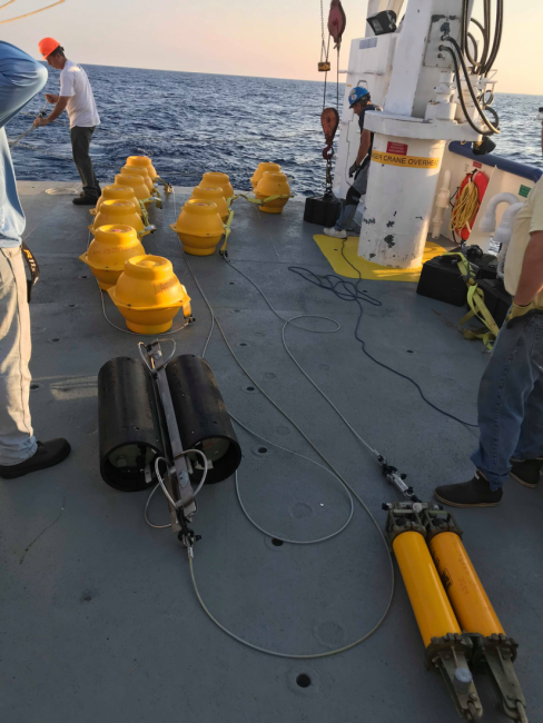 A yellow device aboard a vessel.