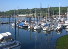 A boat dock with several small boats. 