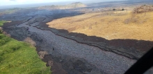 An aerial image of a river of black lava.