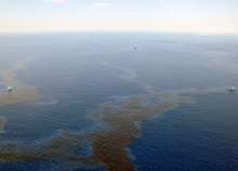An aerial view of an oil sheen in water. 