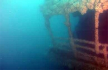 An underwater image of a sunken vessel.