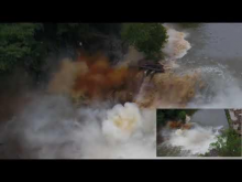 Two images, a smaller one overlapping in the corner, of a dam being blown up. 