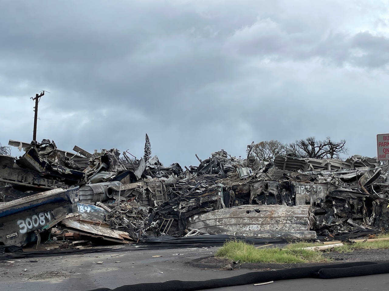 Burned and damaged vessels removed from Lahaina Harbor at the disposition lot in Lahaina, Maui.