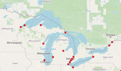 A map of the Great Lakes with red dots highlighting spills. 