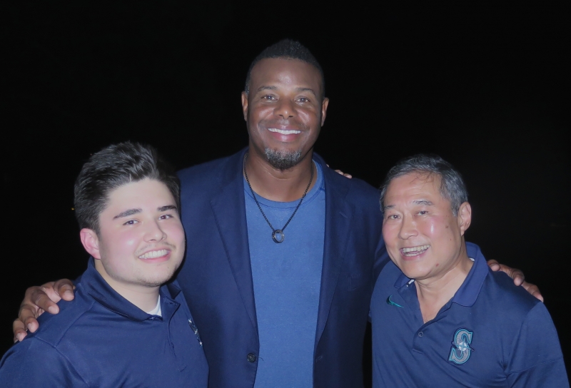 Three men posing for a photo.