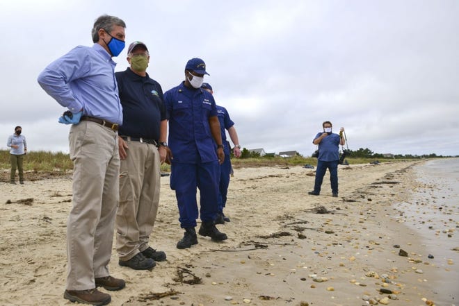 A group of people on a beach.