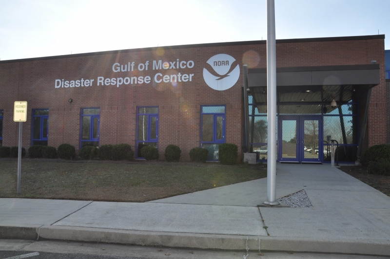 A building with lettering on the side reading "Gulf of Mexico Disaster Response Center." 