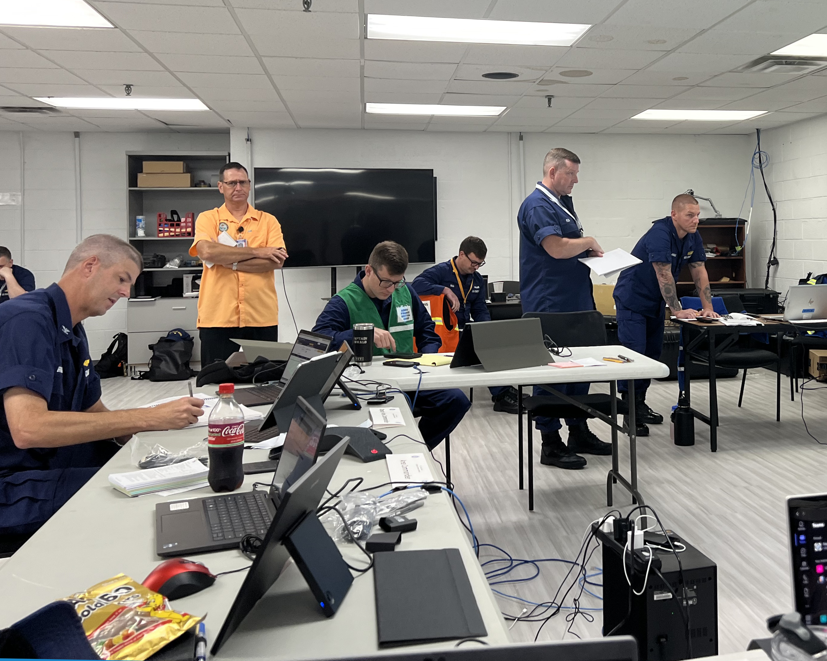 Emergency response personnel work within an Area Command Post.