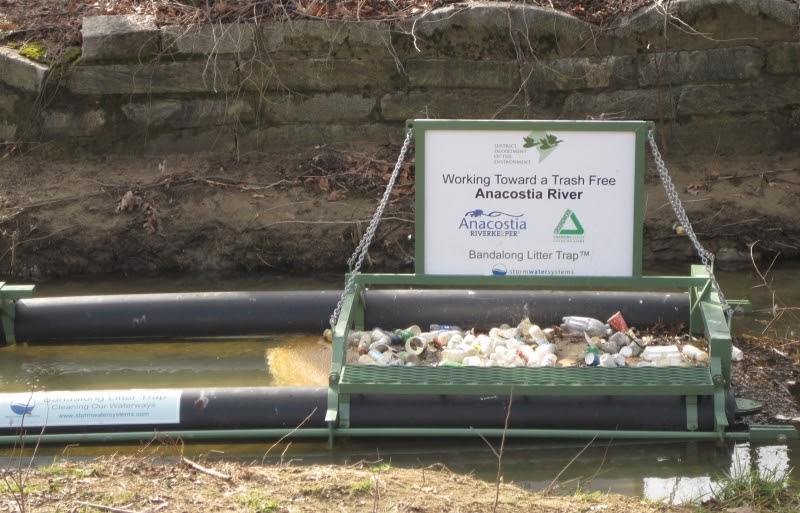 Example of a floating trash boom installed on a river. 