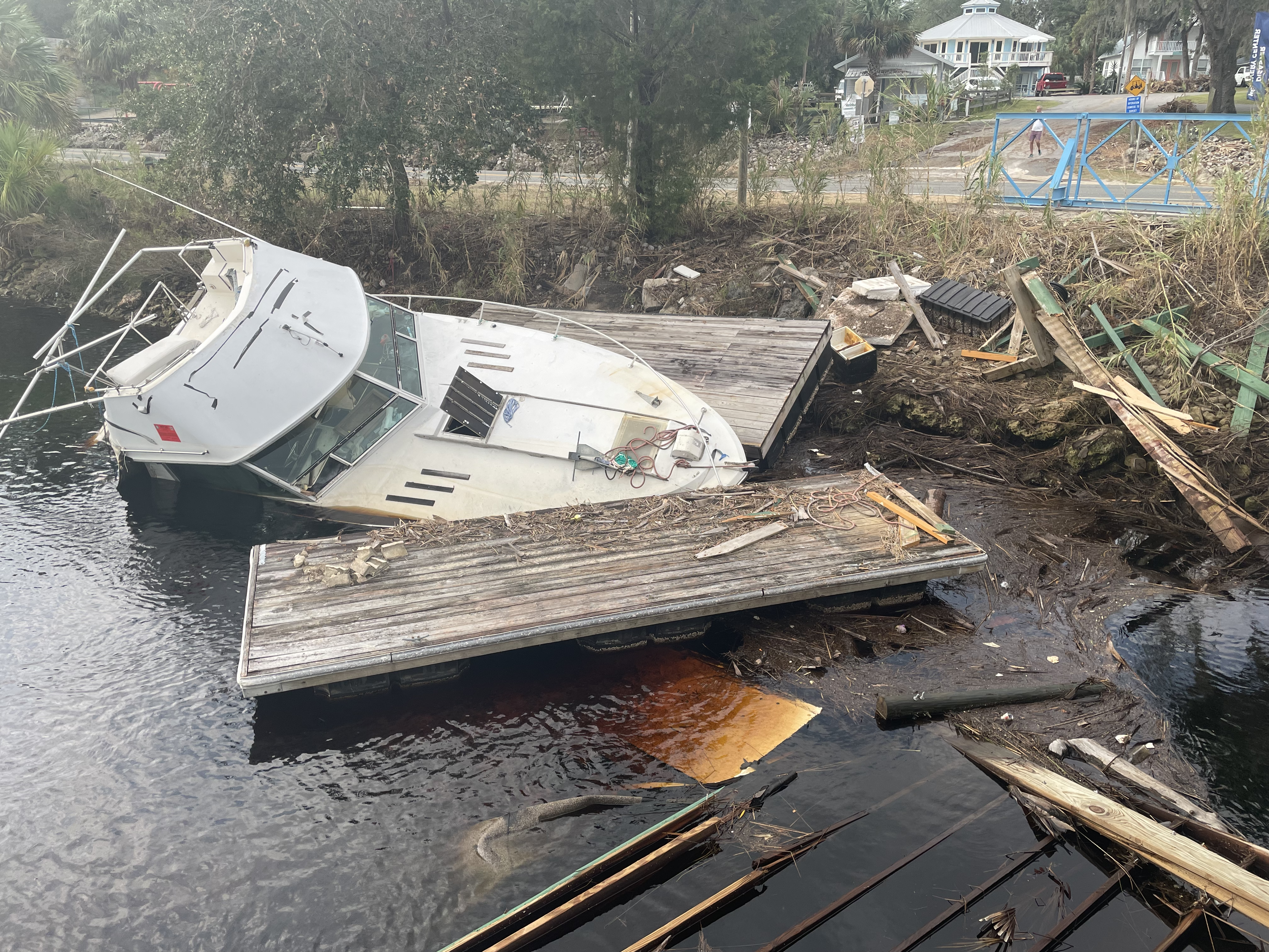 A derelict vessel and other debris generated from Hurricane Idalia along the Steinhatchee River in Florida.