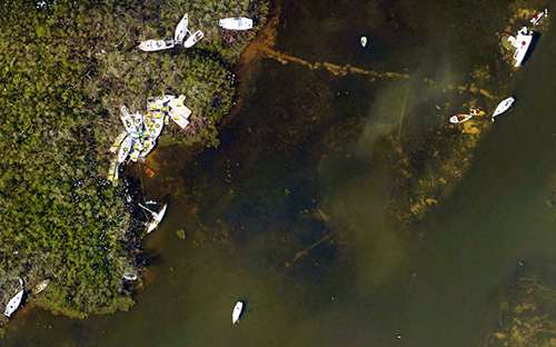 An aerial view of a damaged shoreline.