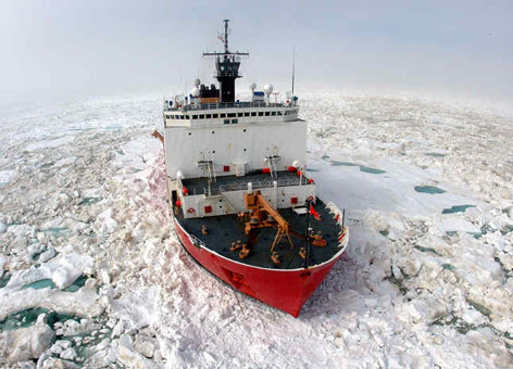 A Coast Guard icebreaker works its way through ice in the Arctic.