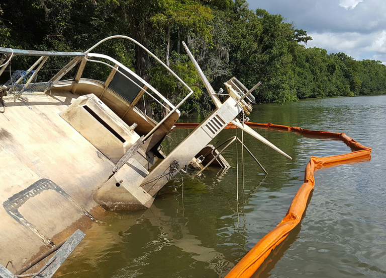 A pollution boon around a partially submerged vessel. 