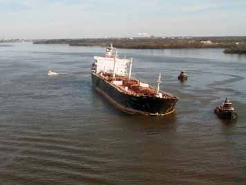 A vessel with oil in the water around it.