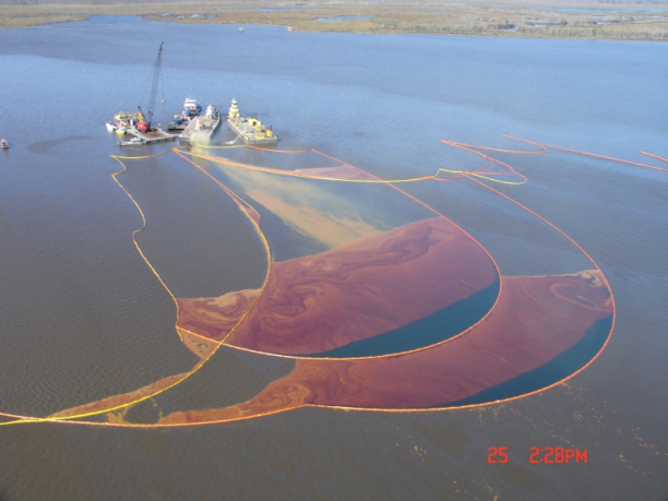 A sheen of black, red, and yellow on a body of water. 