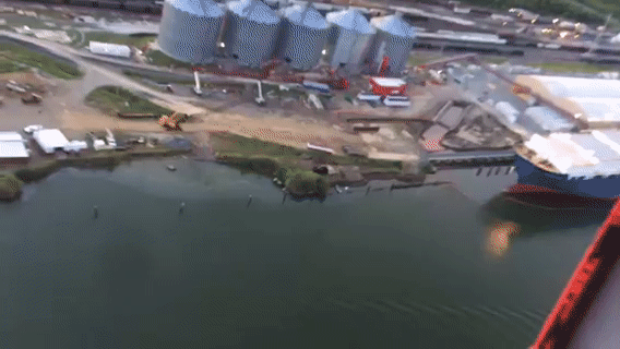 An animated GIF of an overflight depicting oil along a shoreline. 