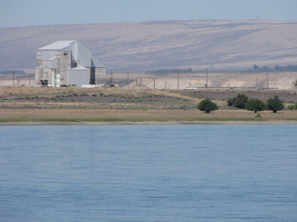 A facility as seen from the other side of the river.