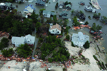 An aerial image of a flooded area with hurricane damage.