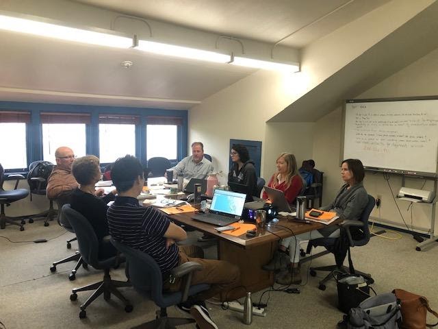 A group of people at a conference table.