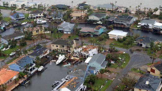 An aerial view of a flooded residential area. 