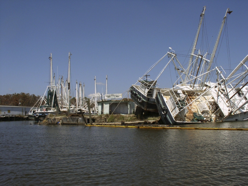 Two grounded vessels lying on their sides. 