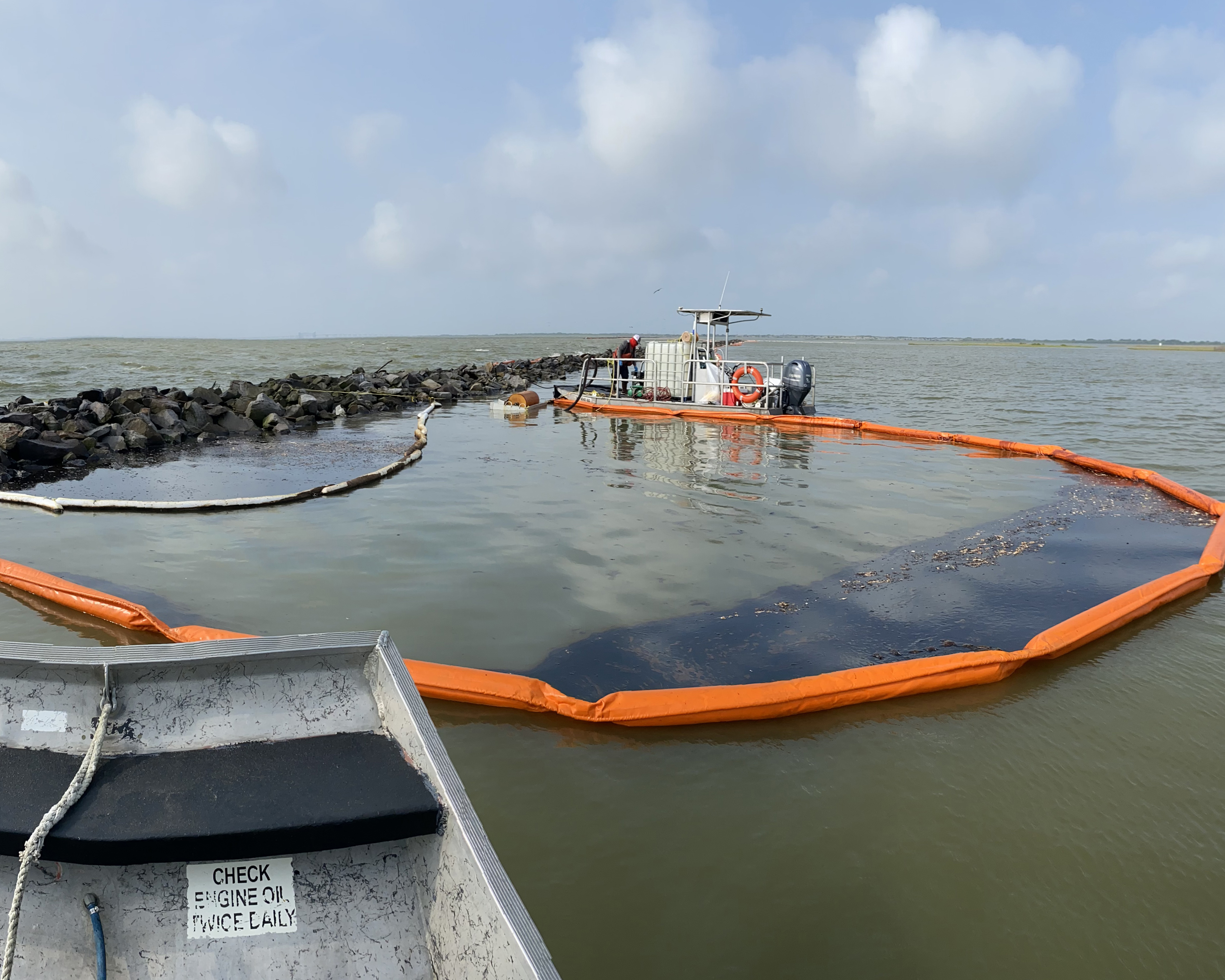 Oil collected in a floating spill boom.