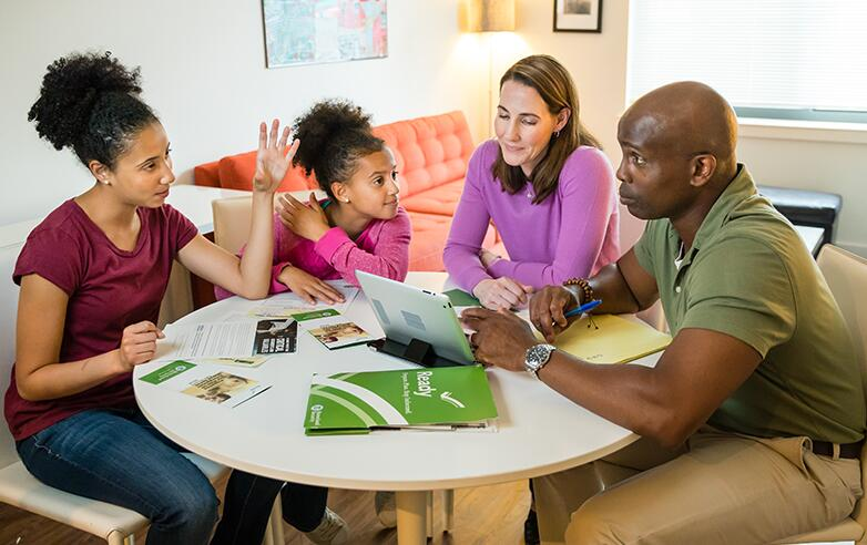 Four people sitting at a table.