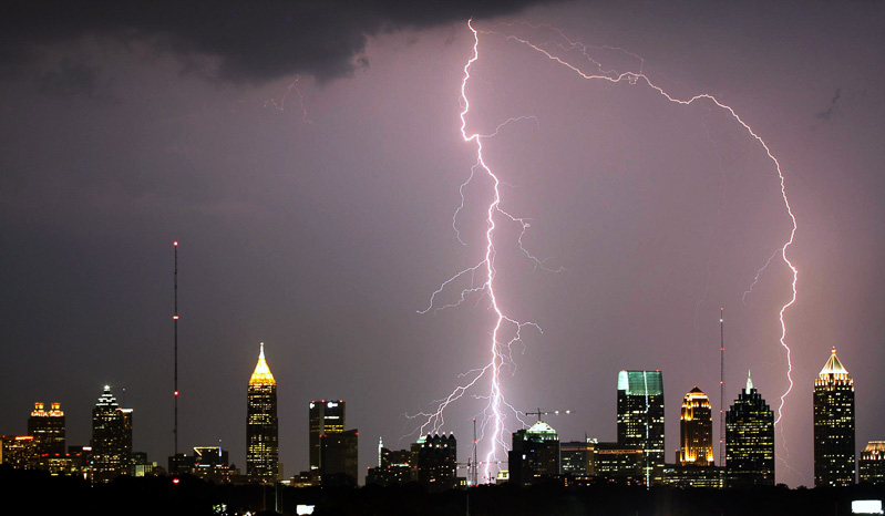 A cityscape with lightening striking.