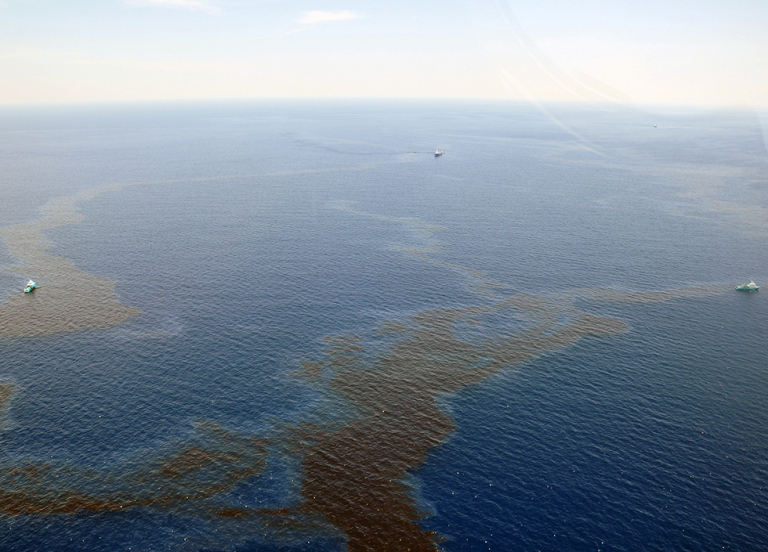 An aerial view of an oil sheen in water. 