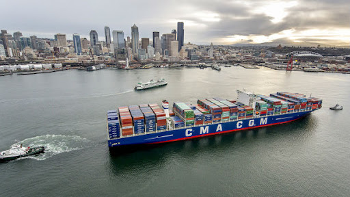 A shipping vessel near a city port.