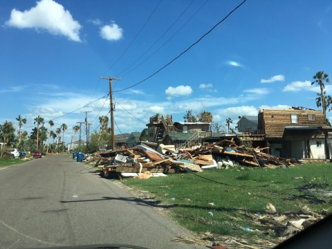 Hurricane debris along a street.