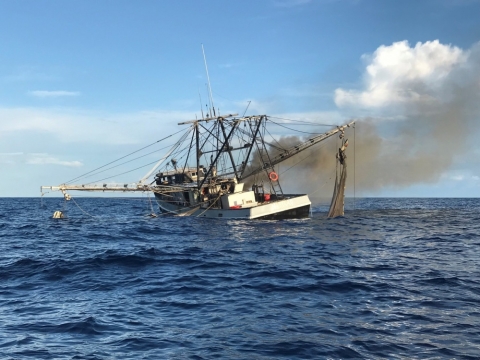 Smoke coming from a vessel. 