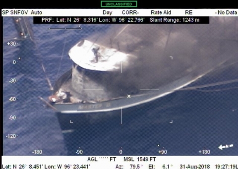 Smoke rising from a vessel. 