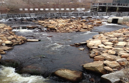 A fishway running under a building. 