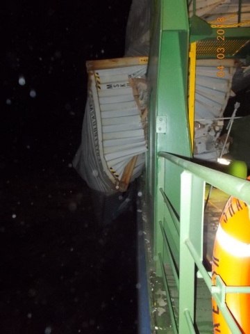 A shipping container that fell and was crushed by other falling containers. 