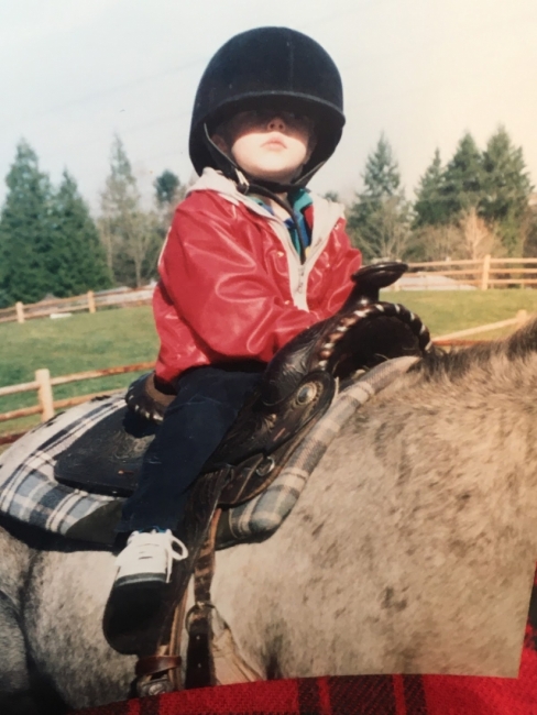 A child on a horse.