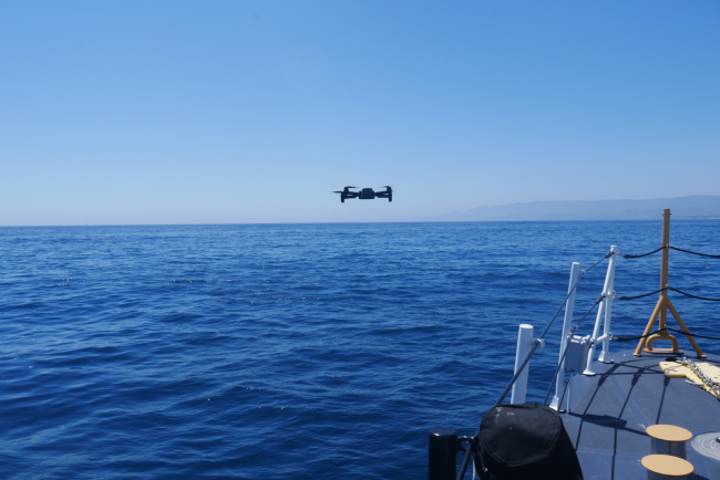 UAS above water, preparing for landing on the USCG Cutter Blackfin. 