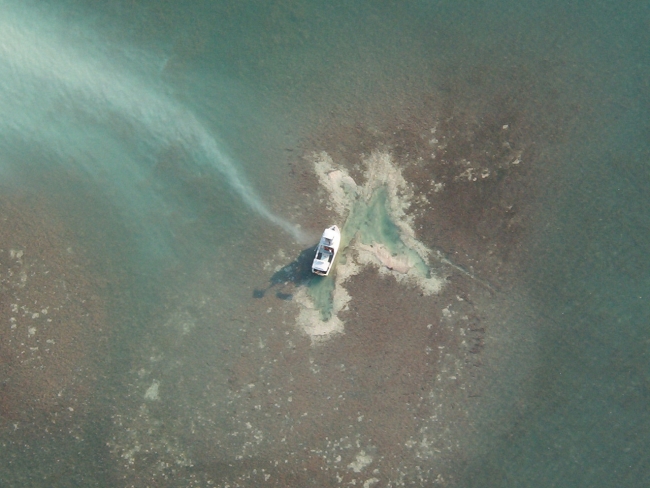 An aerial view of a grounded vessel. 