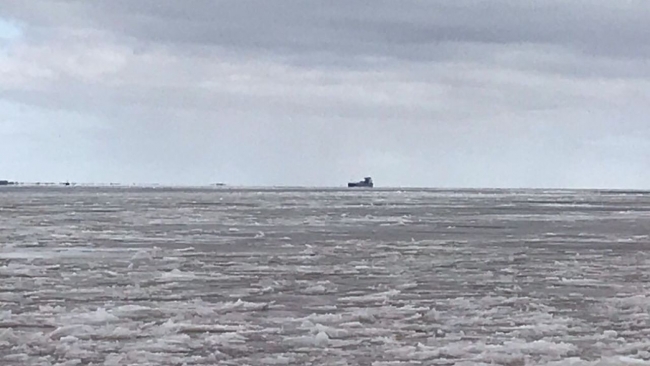 A grounded boat on the horizon. 