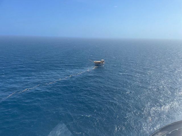 An aerial image of oil coming from a platform.