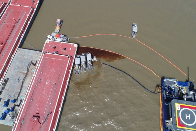 Oil next to a barge.
