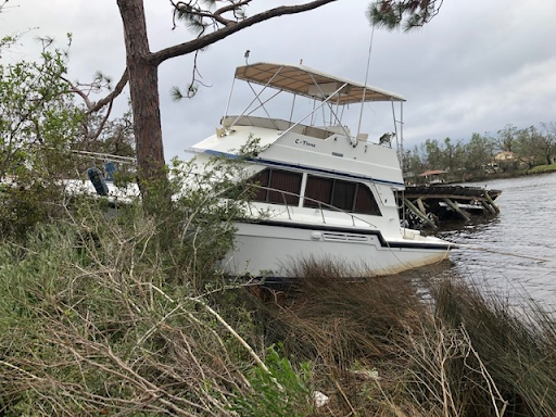 A derelict boat washed ashore after Hurricane Michael.