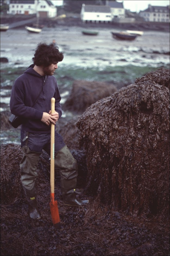 A man holding a shovel. 