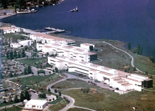 An aerial view of a campus on a shoreline. 